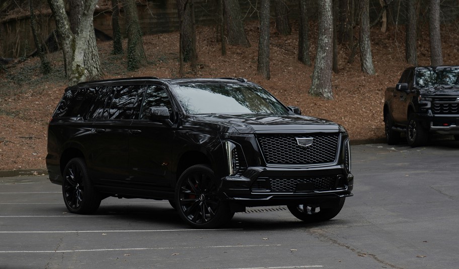 Black full-size luxury SUV for airport transfers